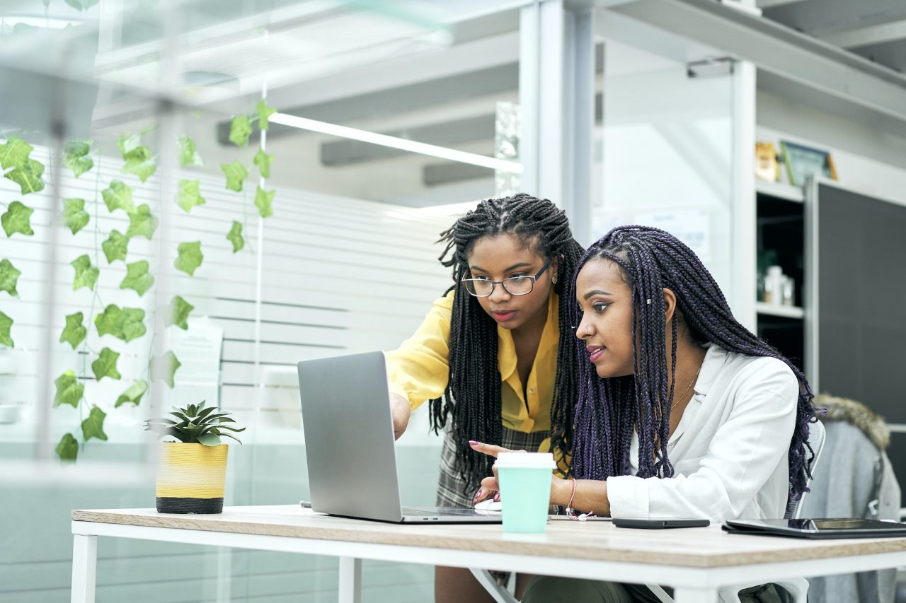 female-co-workers-in-the-office-discussing-marketing-strategies-reviewing-analytical.jpg